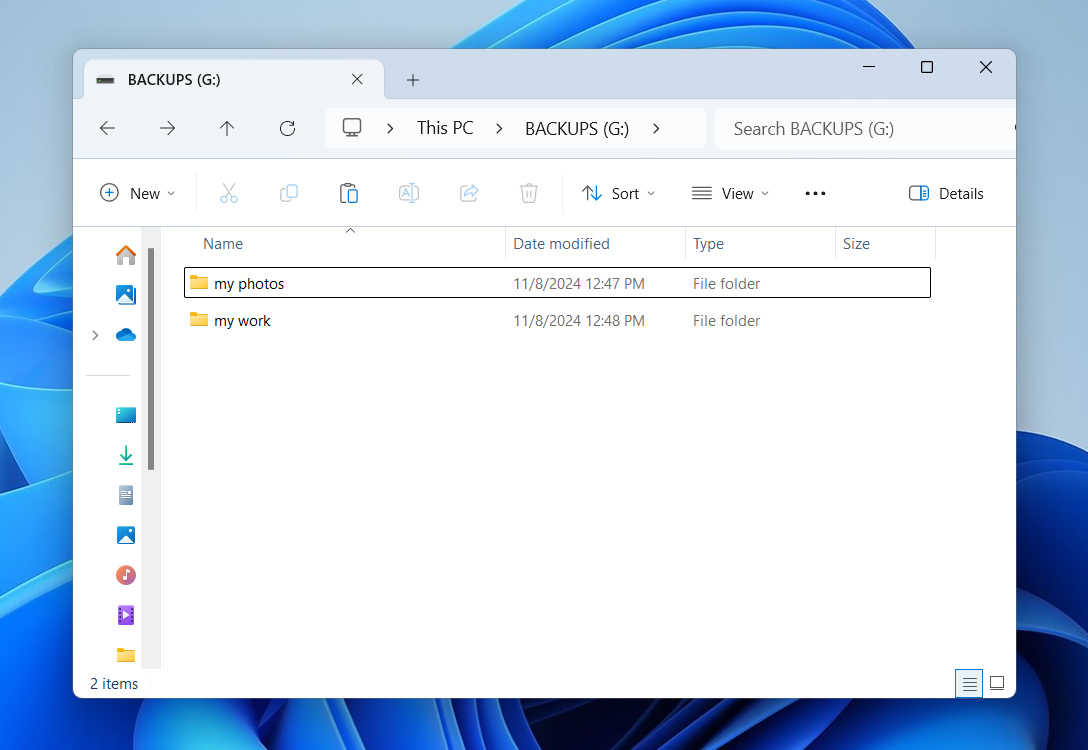 Windows Explorer view showing backup folders named 'my photos' and 'my work' on a G: drive